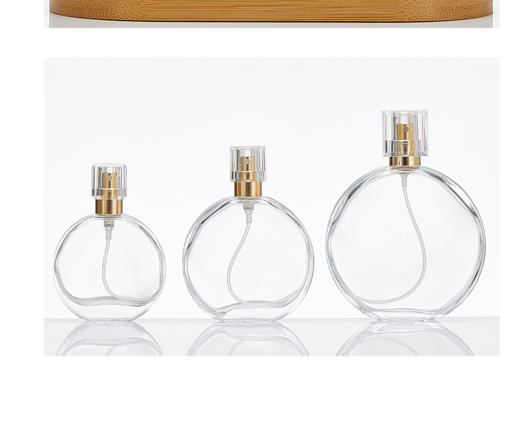 round transparent glass perfume spray bottle