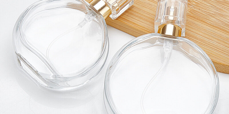 round transparent glass perfume spray bottle