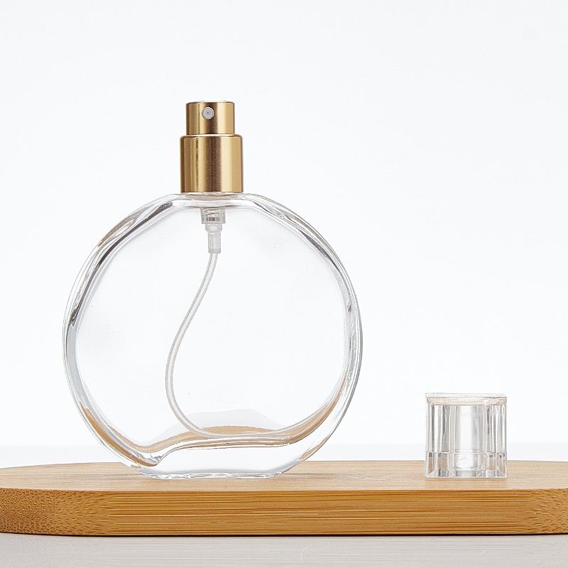 round transparent glass perfume spray bottle